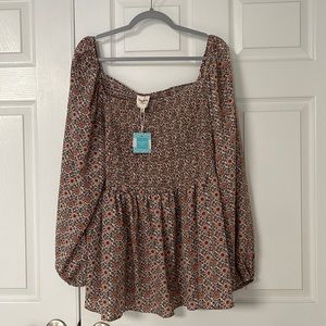 Smocked floral peplum top